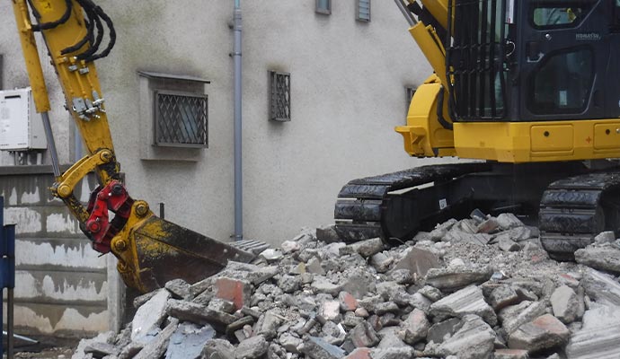 destroy a house with a power shovel selective demolition