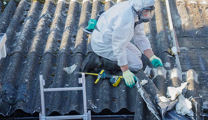 Professional worker  removing asbestos