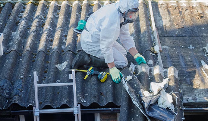 Professional worker removing asbestos